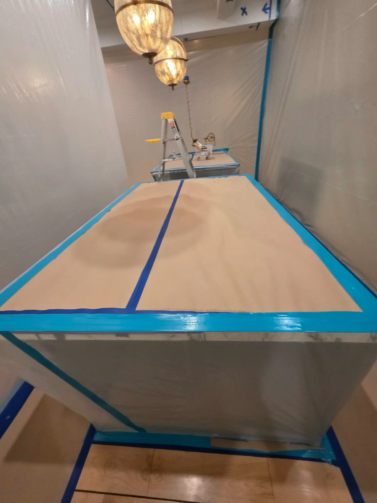Plastic containment and protective coverings around kitchen surfaces